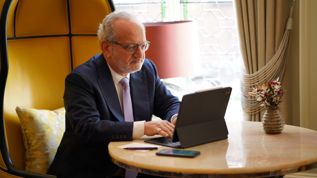 George Jerjian sat at a laptop writing his book